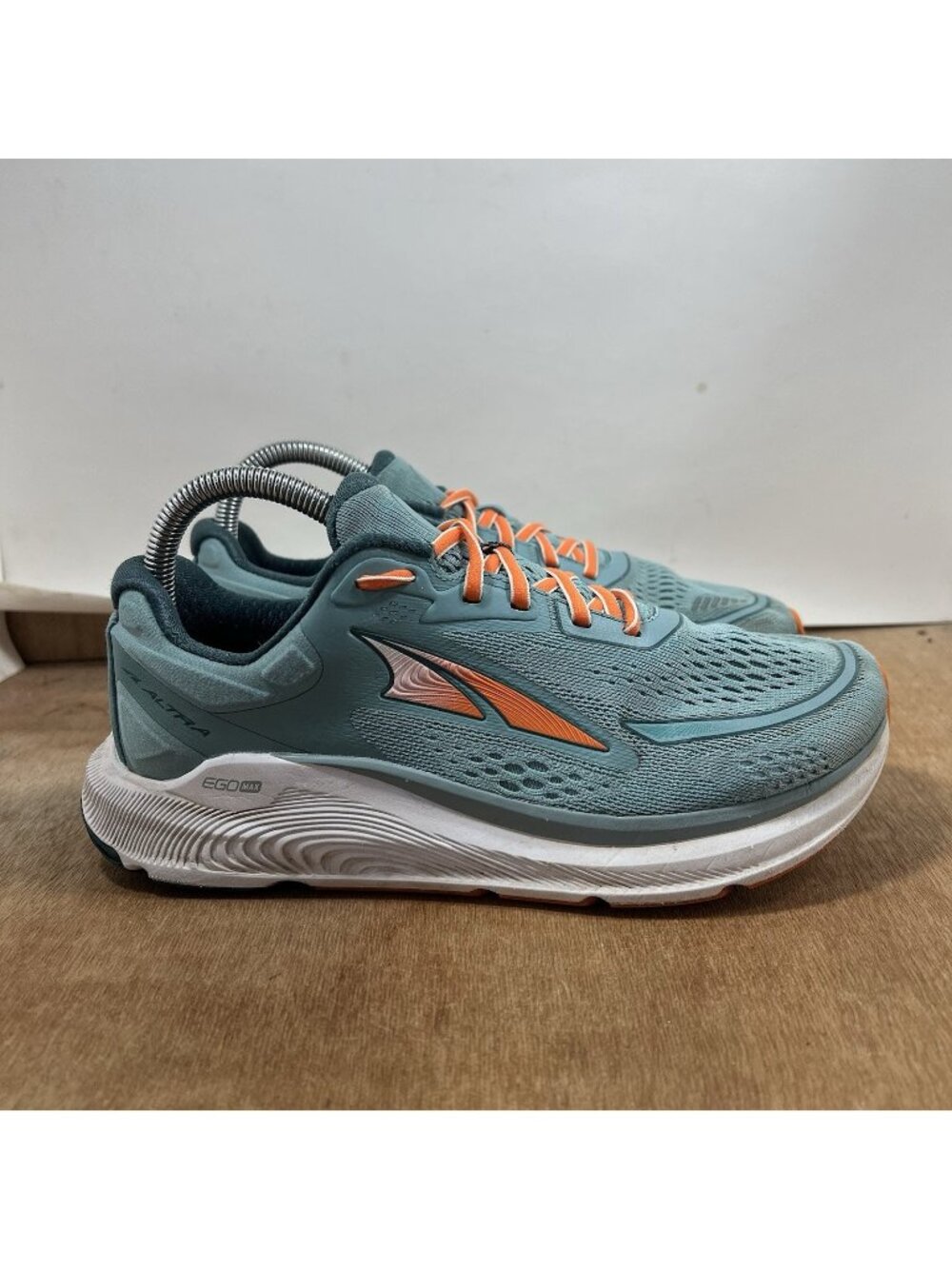 Light Blue Athletic Running Shoes with Orange Accents